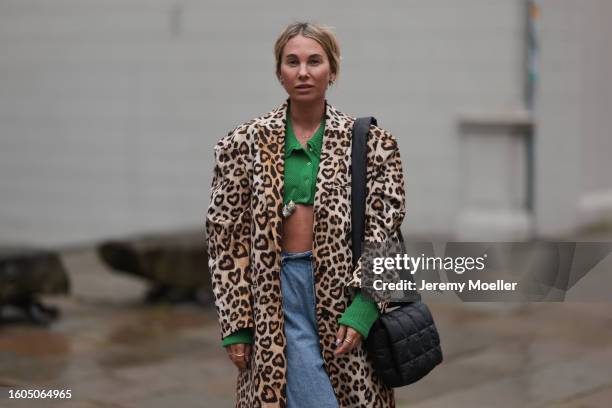 Karin Teigl seen wearing Milk White green knit cropped top with long sleeves, H&M beige / brown leopard pattern long coat, black rose hair clip, Vee...