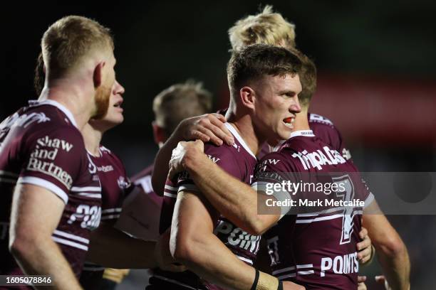 Reuben Garrick of the Sea Eagles celebrates scoring a try with team mates during the round 24 NRL match between Manly Sea Eagles and Penrith Panthers...