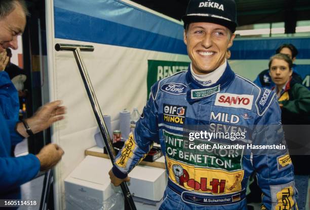 German racing driver Michael Schumacher, wearing a black DEKRA baseball cap and blue coveralls, ahead of the Belgian Grand Prix, held at the Circuit...