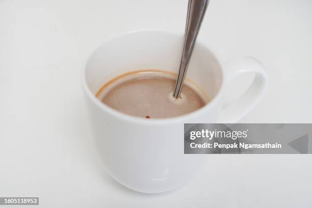 black coffee in white on white background - coffee spoon stock pictures, royalty-free photos & images