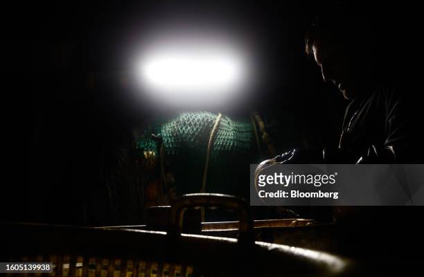 Fisherman cleans the fish from his catch aboard fishing boat 'About Time' while trawling in the English Channel near Newhaven UK, on Wednesday,...