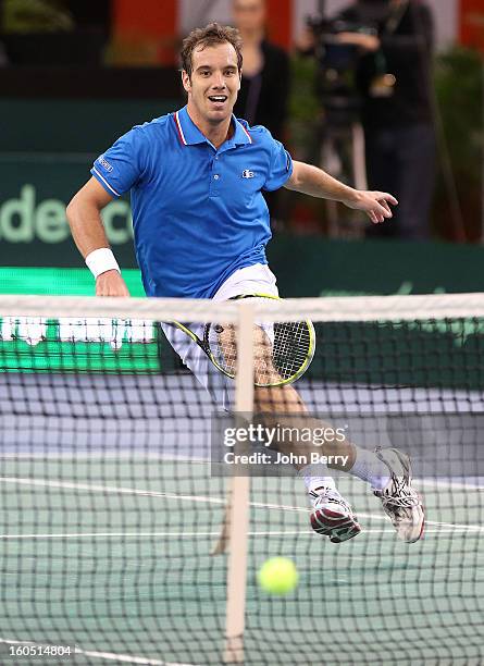 Richard Gasquet of France plays a volley during his match against Dudi Sela of Israel on day one of the Davis Cup first round match between France...