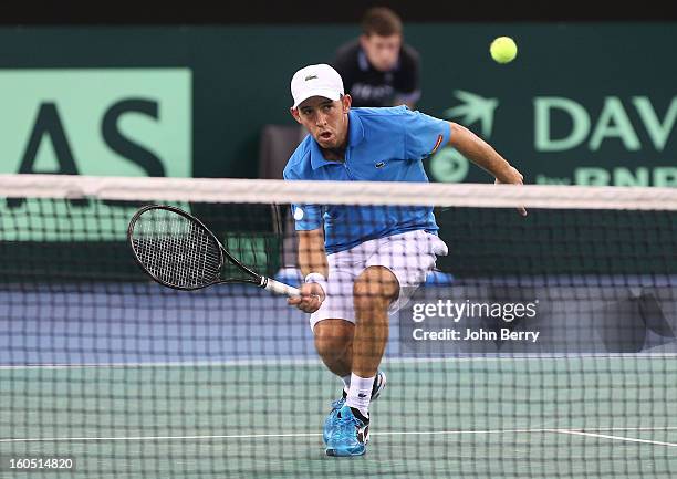 Dudi Sela of Israel plays a volley against Richard Gasquet of France on day one of the Davis Cup first round match between France and Israel at the...