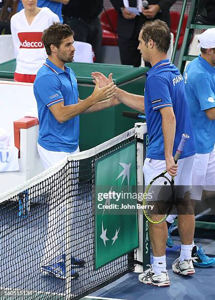 France coach Arnaud Clement congratulates Richard Gasquet of France after his victory against Dudi Sela of Israel on day one of the Davis Cup first...