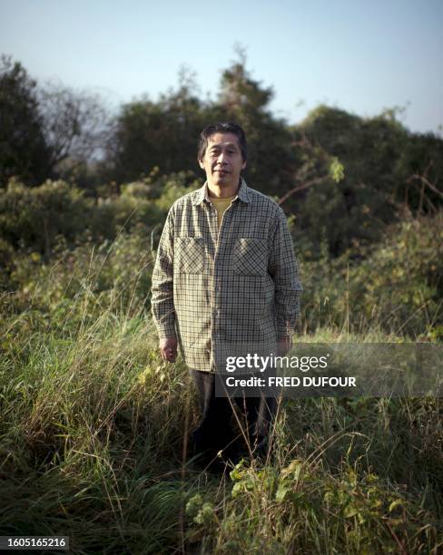 Japan's Asafumi Yamashita, who owns a vegetable garden and table d'hotes, poses on November 16, 2011 in Chapet, outside Paris, in his garden. Asafumi...