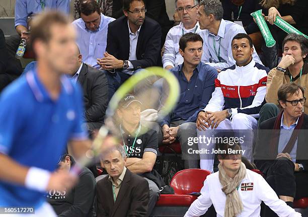 France coach Eric Winogradsky and Jo-Wilfried Tsonga of France looks on during the first round match between Richard Gasquet France and Dudi Sela of...