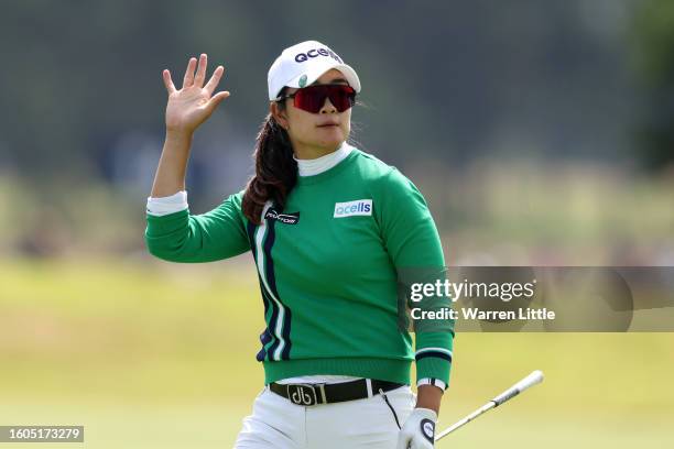 Lim Kim of South Korea acknowledges the crowd on the 18th hole green on Day One of the AIG Women's Open at Walton Heath Golf Club on August 10, 2023...