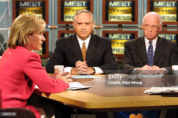 From left, Andrea Mitchell of NBC News speaks as Paul Gigot of the Wall Street Journal and David Broder of the Washington Post look on during a...