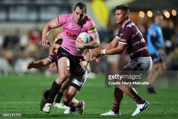 Isaah Yeo of the Panthers is tackled during the round 24 NRL match between Manly Sea Eagles and Penrith Panthers at 4 Pines Park on August 10, 2023...