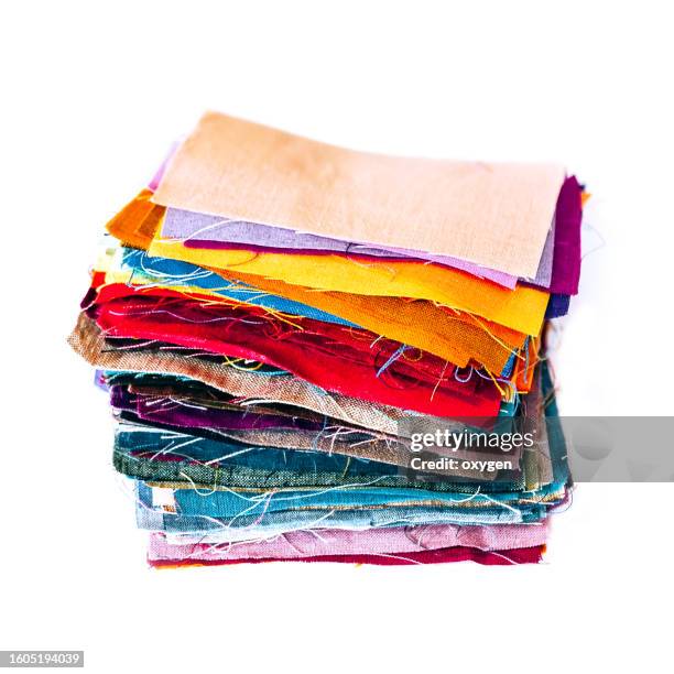 stack of linen fabrics multi colored isolated on white background - échantillon de tissu photos et images de collection
