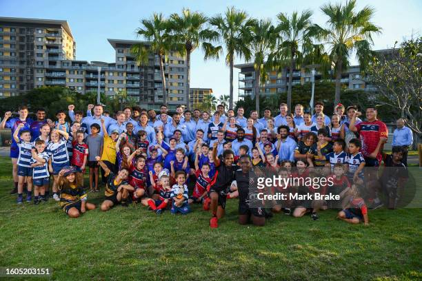 Local young rugby players join in the Wallabies team photo during the Australia Wallabies Rugby World Cup Squad Announcement at Darwin Waterfront on...