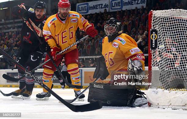 Iva Ciernik of Hannover fails to score over Felix Bick , goaltender of Duesseldorf during the DEL match between Hannover Scorpions and Duesseldorfer...