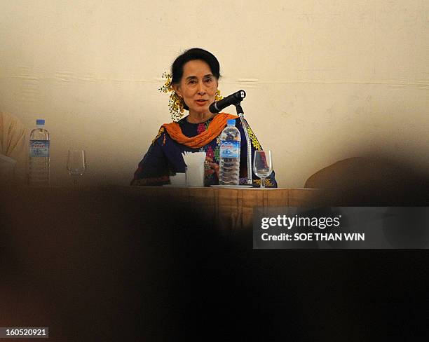 Myanmar opposition icon Aung San Suu Kyi attends the Irrawaddy Literary festival press conference at Inya Lake hotel in Yangon on February 2, 2013....