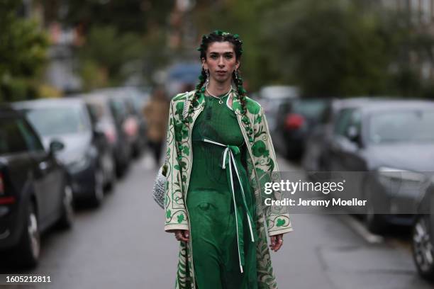 Canel Aylin green flower hair accessory, silver earrings and necklace, green print pattern long tulle dress with a bow detail, green / white latte...