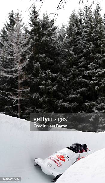 Justin Kripps, Timothy Randall, James McNaughton and Graeme Rinholm of Canada compete during the Four Men Bobsleigh heat one of the IBSF Bob &...