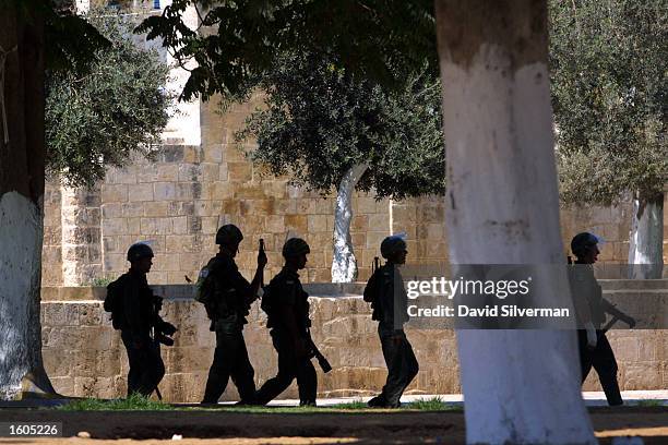 Israeli police officers patrol the Temple Mount at the end of clashes July 29,2001 in Jerusalem''s Old City.