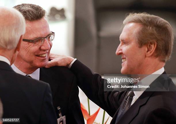 Thomas de Maiziere , German minister of defense welcomes, William S. Cohen, former U.S. Secretary of defense, during day 2 of the 49th Munich...