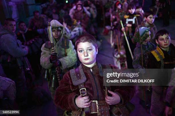 Boy attends the opening ceremony of the International Festival of the Masquerade Games in Pernik near the capital Sofia, on February 1, 2013. The...