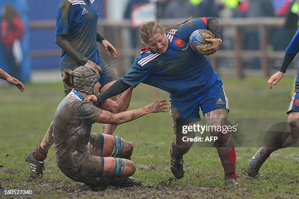 France's Julie Duval vies with Italian's Silvia Gaudino during the Six Nations women Rugby Union match between Italy and France on February 2, 2013...