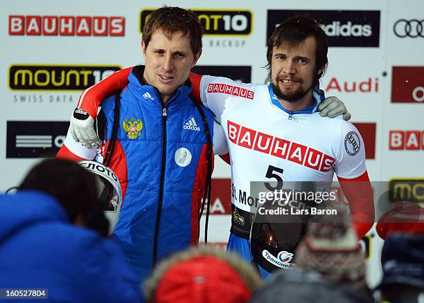 Alexander Tretjyakov of Russia celebrates with Sergei Chudinov of Russia after winning the man's skeleton final heat of the IBSF Bob & Skeleton World...