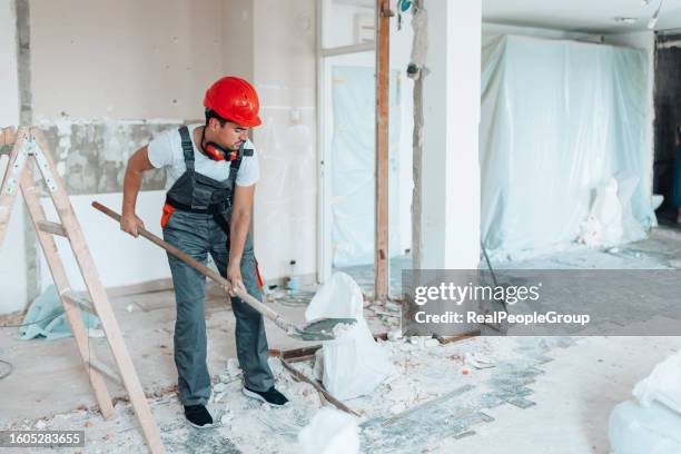 expert builder reshaping apartments with precision - crash site stock pictures, royalty-free photos & images