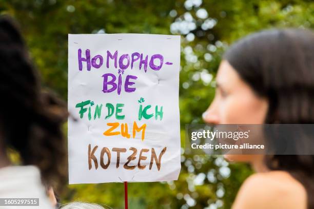 August 2023, Berlin: "Homophobia makes me want to puke" is written on a sign during a demonstration against queer-hostile violence in Berlin's...