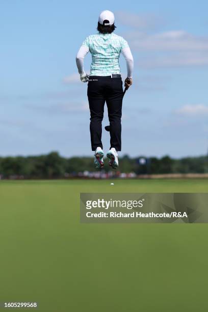 Nasa Hataoka of Japan jumps ahead of her second shot on the 11th hole on Day One of the AIG Women's Open at Walton Heath Golf Club on August 10, 2023...