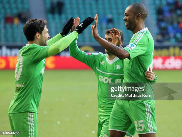 Naldo of Wolfsburg jubilates with team mate Diego after scoring the first goal during the Bundesliga match between VFL Wolfsburg and FC Augsburg at...