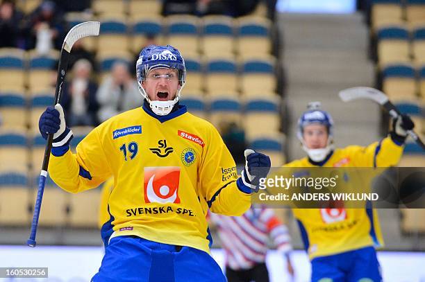 Sweden's Patrik Nilsson reacts after scoring the 1-0 goal during Bandy World Championship semifinal match Sweden vs Finland in Vanersborg, Sweden,...