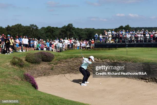 Nasa Hataoka of Japan plays a shot from a greenside bunker on the 11th hole on Day One of the AIG Women's Open at Walton Heath Golf Club on August...