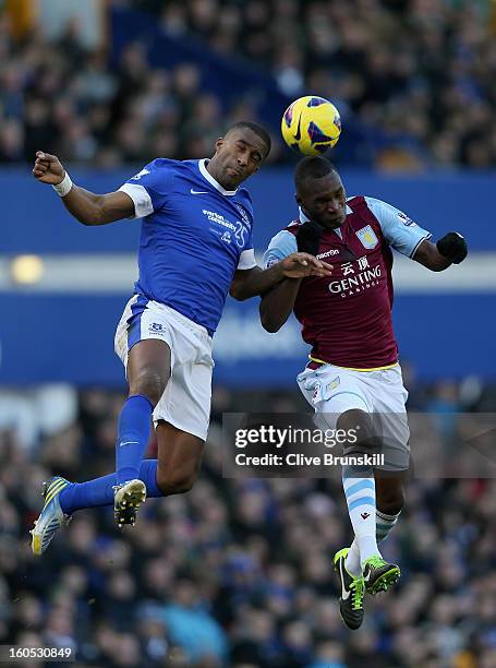 Sylvain Distin of Everton in action with Christian Benteke of Aston Villa during the Barclays Premier League match between Everton and Aston Villa at...