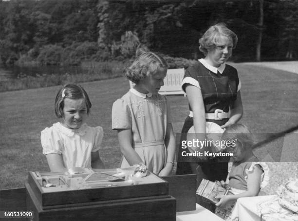 Princess Irene of the Netherlands celebrates her thirteenth birthday with her sisters at Soestdijk Palace, Netherlands, 5th August 1952. Left to...