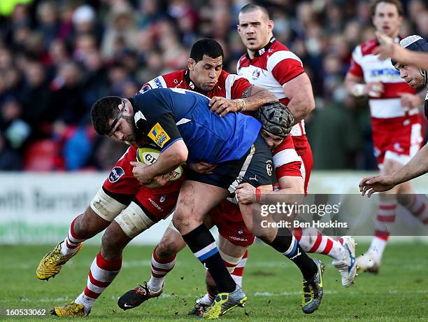 Rob Webber of Bath is tackled by Lua Lokotui of Gloucester during the LV= Cup match between Gloucester and Bath at the Kingsholm Stadium on February...