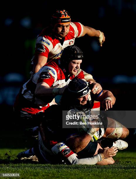 Carl Fearns of Bath is tackled by Rupert Harden of Gloucester during the LV= Cup match between Gloucester and Bath at the Kingsholm Stadium on...