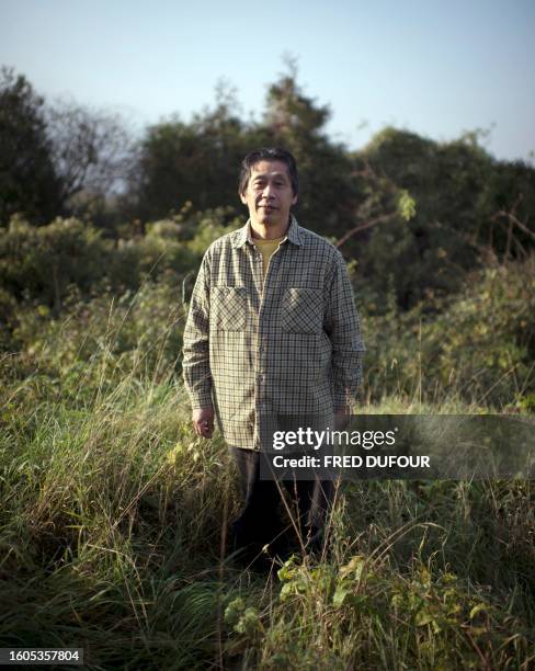 Japan's Asafumi Yamashita, who owns a vegetable garden and table d'hotes, poses on November 16, 2011 in Chapet, outside Paris, in his garden. Asafumi...