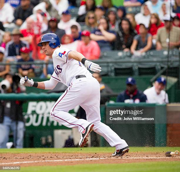 Seattle Rangers Michael Young of the Texas Rangers runs to first base during the game ...