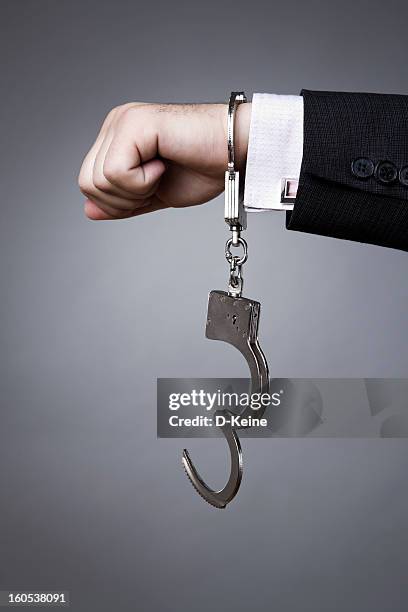 handcuffs - snatch stock pictures, royalty-free photos & images