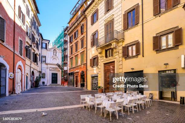 the characteristic small square of largo dei librari in the campo de fiori district in the historic heart of rome - bar wide angle stock pictures, royalty-free photos & images