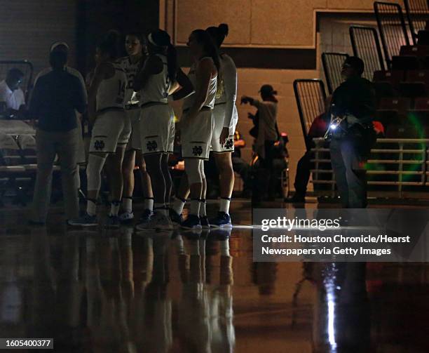 Notre Dame players stand on the court during a power outage in the first half of the non conference women's basketball game against Louisiana...