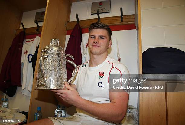 Owen Farrell of England poses with the Calcutta Cup in the dressing room after the RBS Six Nations match between England and Scotland at Twickenham...