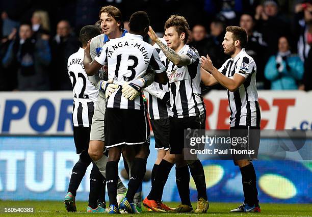 Tim Krul of Newcastle hugs team-mate Mapou Yanga-Mbiwa at full time of the Premier League match between Newcastle United and Chelsea at St James Park...