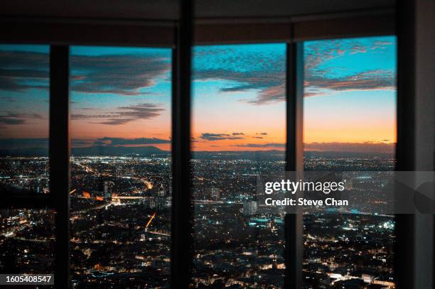 melbourne city at dusk through window - team sport australia stock pictures, royalty-free photos & images