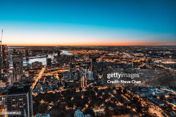 aerial view of melbourne city at dusk - team sport australia stock pictures, royalty-free photos & images