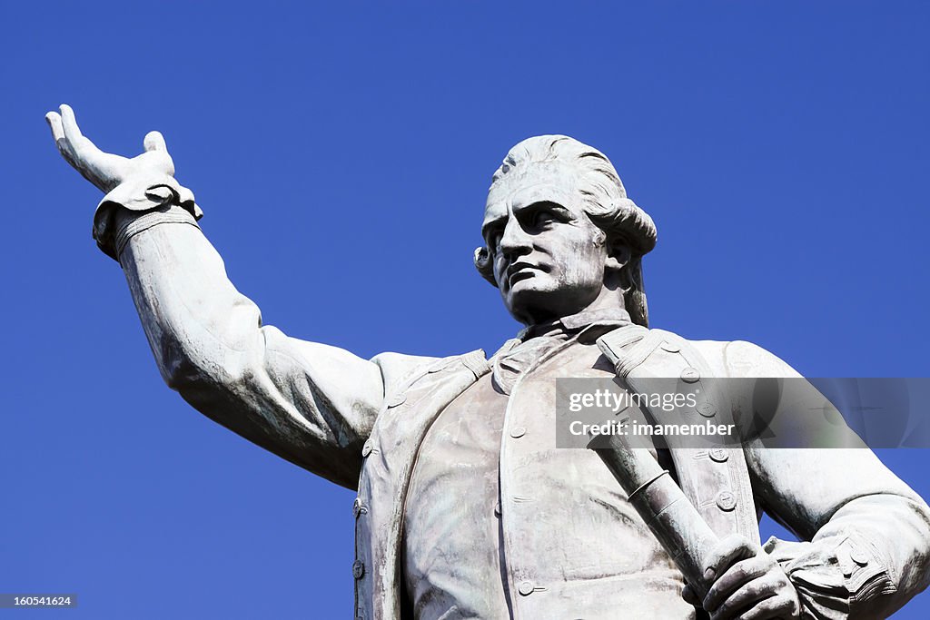 Statue of Captain James Cook against blue sky, copy space