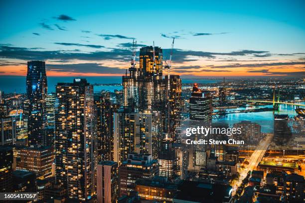 aerial view of melbourne cbd and yarra river at dusk - team sport australia stock pictures, royalty-free photos & images
