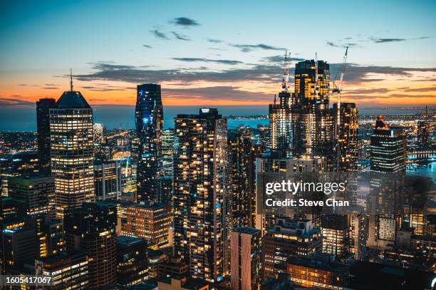 aerial view of melbourne cbd at night - team sport australia stock pictures, royalty-free photos & images