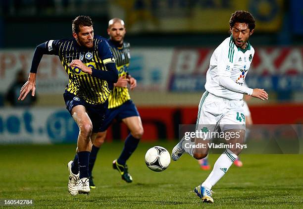 Sebastian Bartolini of Tripolis competes the ball with Yohei Kajiyama of Panathinaikos during the Superleague match between Asteras Tripolis and...