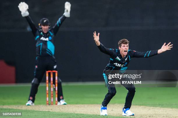 New Zealand's Mitchell Santner appeals for an LBW during the first T20 cricket match between New Zealand and the United Arab Emirates at the Dubai...