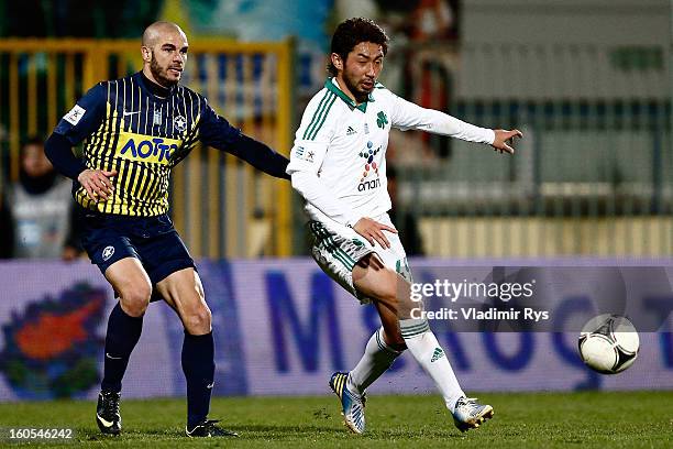 Leandro Alvarez of Tripolis defends as Yohei Kajiyama of Panathinaikos attacks during the Superleague match between Asteras Tripolis and...