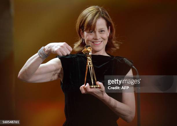 Actress Sigourney Weaver holds her trophy for the Category "best actress international" during the 48th Golden Camera awards ceremony in Berlin on...